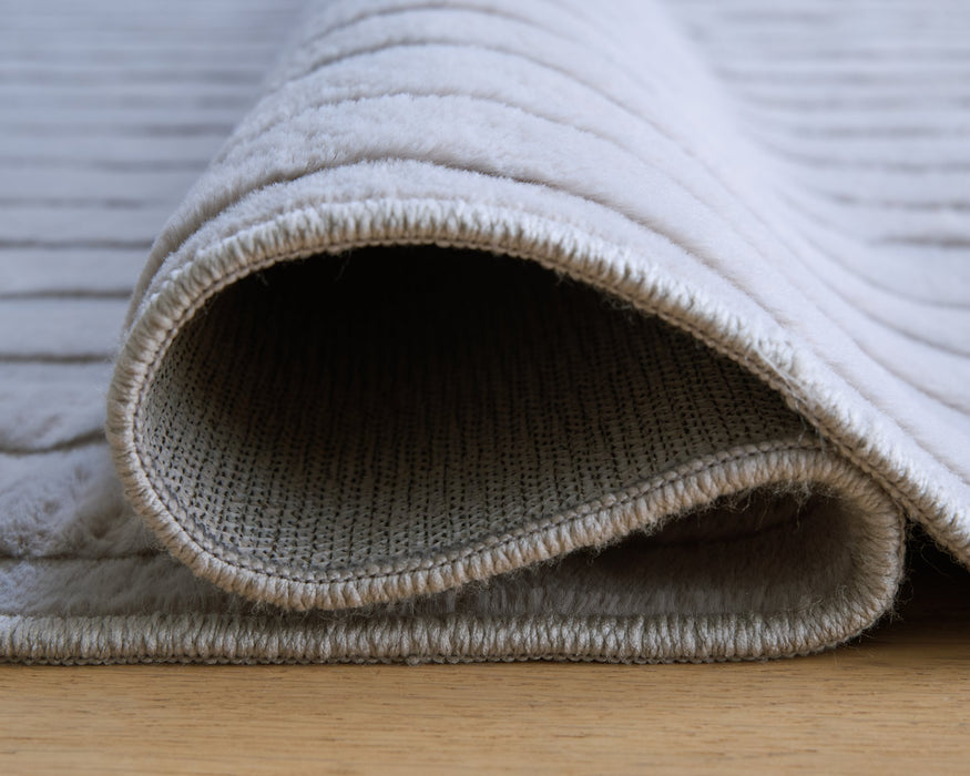Worthley Washable Area Rug - Carl's Furniture (Garden City, KS)